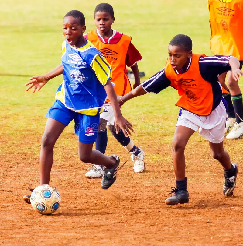 Praise Academy students playing sports outdoors